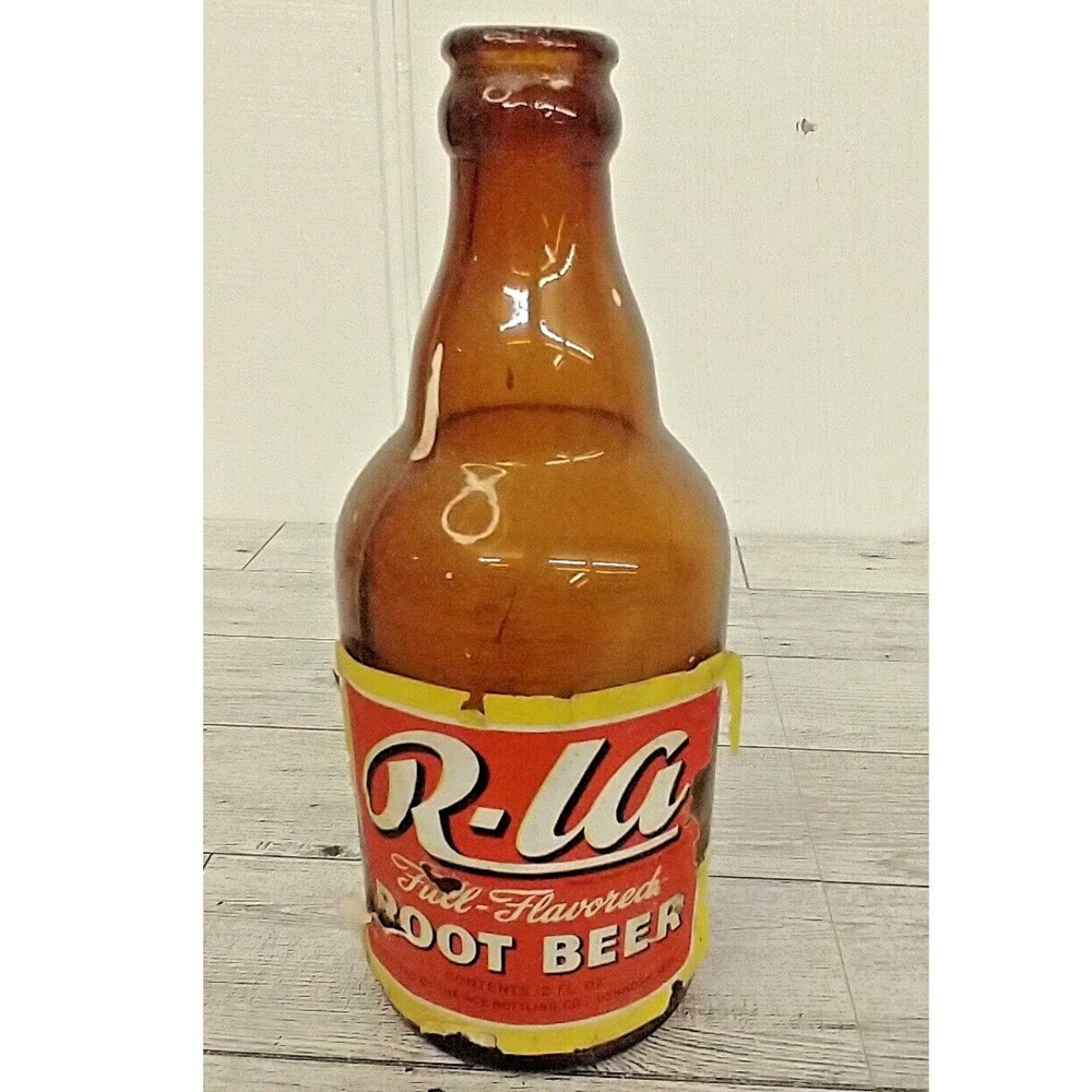 R-la Root Beer Soda 12z Amber Glass Steinie Bottle Oshkosh Wisconsin Paper Label